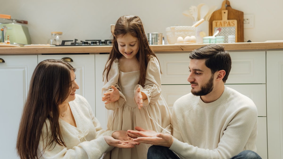 A cheerful family enjoying baking time in their cozy kitchen, fostering love and togetherness.